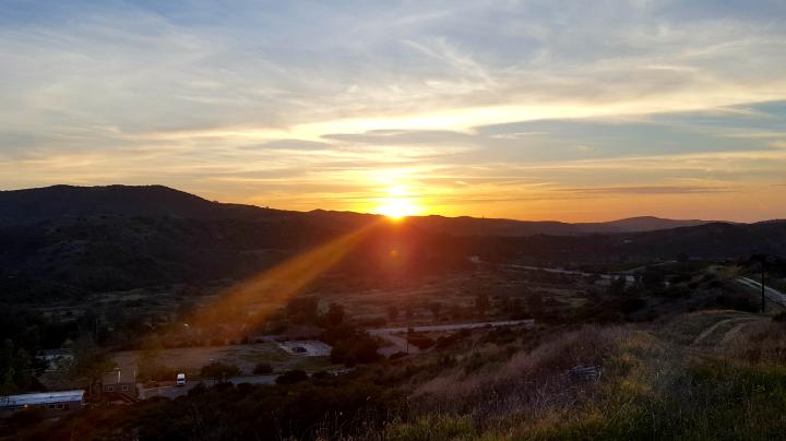 The sun setting over Loma Ridge
