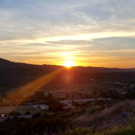 The sun setting over Loma Ridge