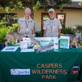 Two Caspers Park volunteers at an info night booth